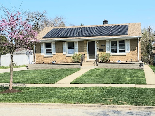 1213 N Irving Ave, Berkeley, IL 60163 - bungalow-style house featuring solar panels, a chimney, and a front yard