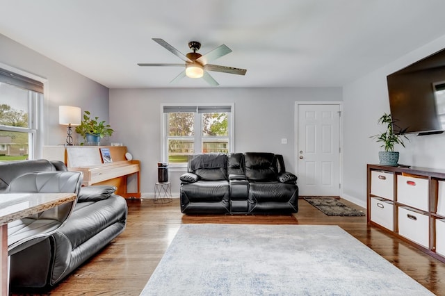 1213 N Irving Ave, Berkeley, IL 60163 - living room with baseboards, a ceiling fan, and wood finished floors