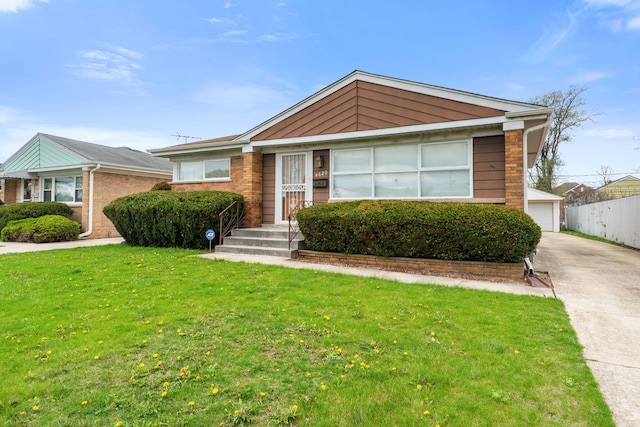 4620 Grace St, Schiller Park, IL 60176 - view of front of house featuring fence, brick siding, a front yard, and a detached garage