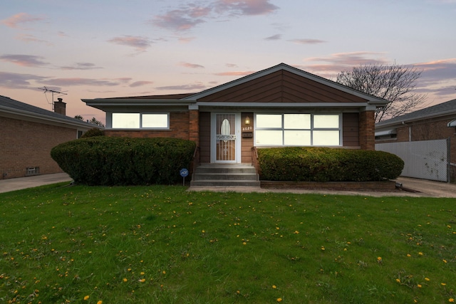 4620 Grace St, Schiller Park, IL 60176 - view of front facade with a lawn and brick siding