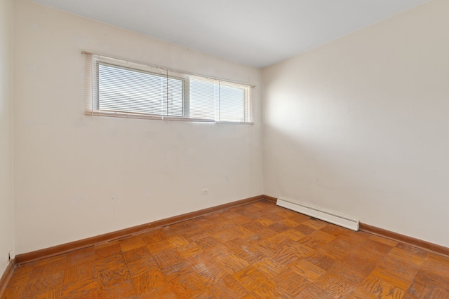 4620 Grace St, Schiller Park, IL 60176 - empty room featuring a baseboard heating unit and baseboards