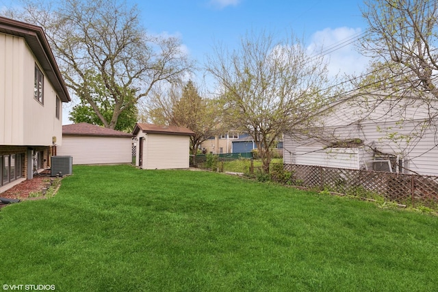 91 Frances Ln, Chicago Heights, IL 60411 - view of yard with a storage shed, fence, central AC unit, and an outdoor structure