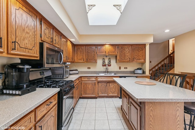 91 Frances Ln, Chicago Heights, IL 60411 - kitchen with a breakfast bar area, light countertops, a sink, light tile patterned floors, and stainless steel appliances