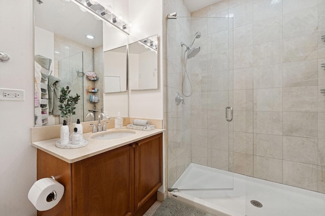 full bathroom featuring a shower stall and vanity
