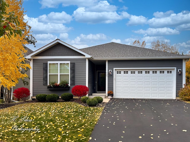 730 Goodfield Lndg, Elgin, IL 60124 - ranch-style house featuring driveway, a front lawn, roof with shingles, and a garage