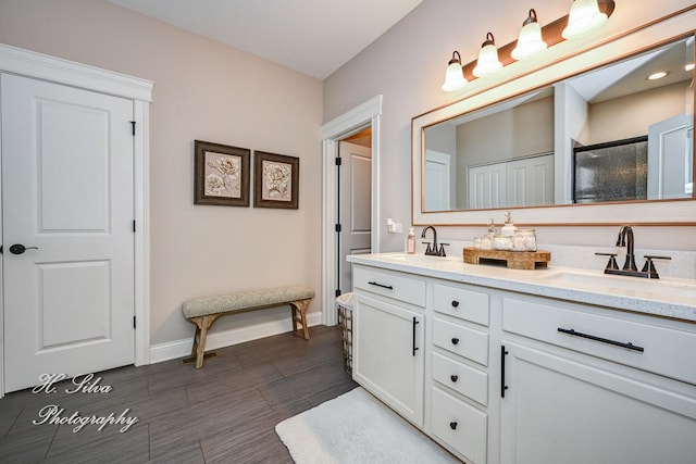 730 Goodfield Lndg, Elgin, IL 60124 - full bath featuring baseboards, a sink, double vanity, and a shower stall