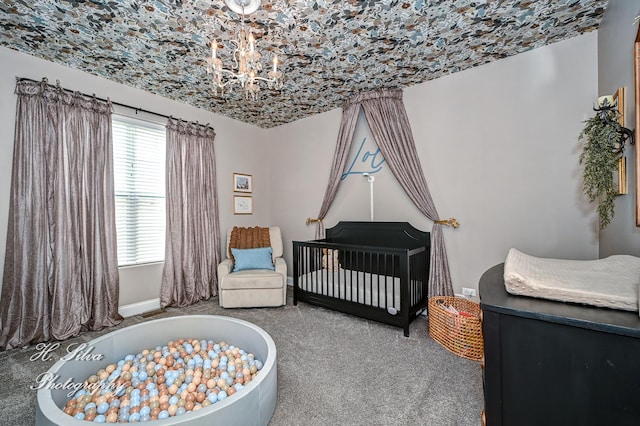 730 Goodfield Lndg, Elgin, IL 60124 - bedroom with baseboards, carpet flooring, a nursery area, and a chandelier