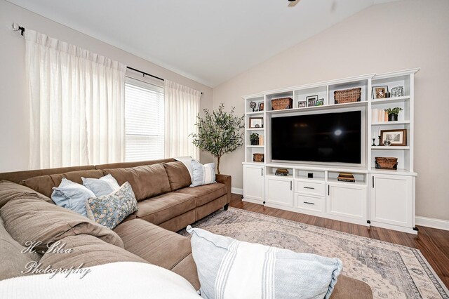 730 Goodfield Lndg, Elgin, IL 60124 - living room featuring baseboards, vaulted ceiling, and wood finished floors