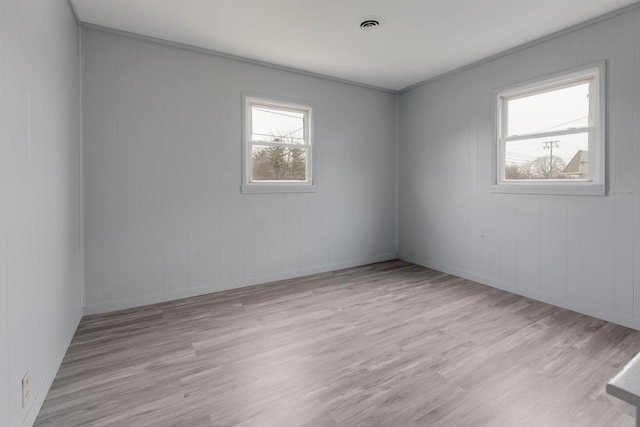 unfurnished room featuring wood finished floors and baseboards
