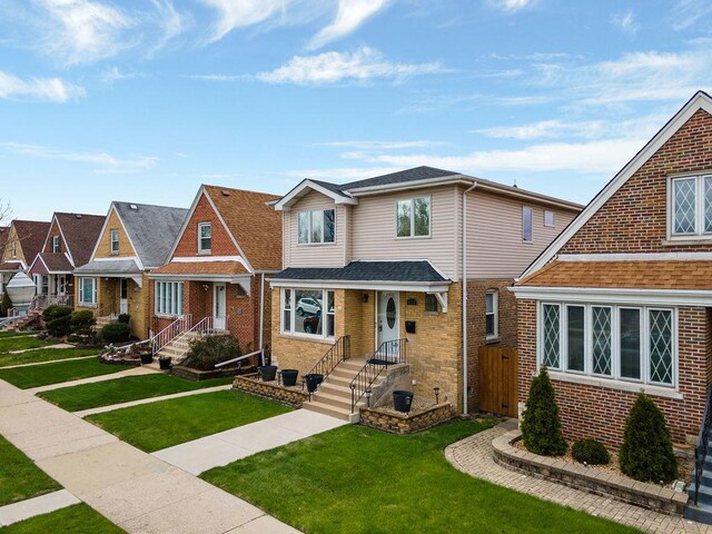 6522 S Kostner Ave, Chicago, IL 60629 - view of front of house featuring brick siding, a residential view, a shingled roof, and a front yard