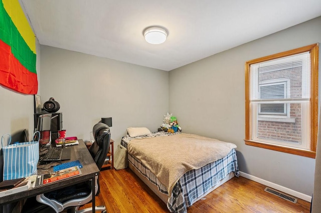 6522 S Kostner Ave, Chicago, IL 60629 - bedroom featuring wood finished floors, visible vents, and baseboards