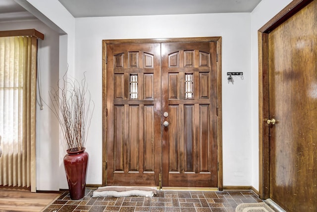 foyer entrance with baseboards