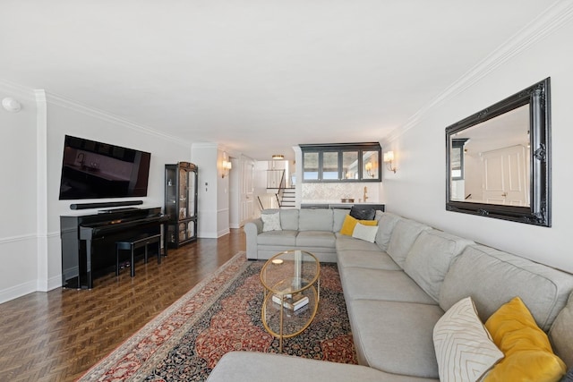 living room featuring stairway, crown molding, and baseboards