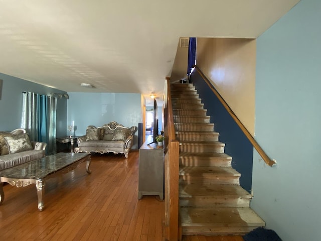 staircase featuring hardwood / wood-style floors