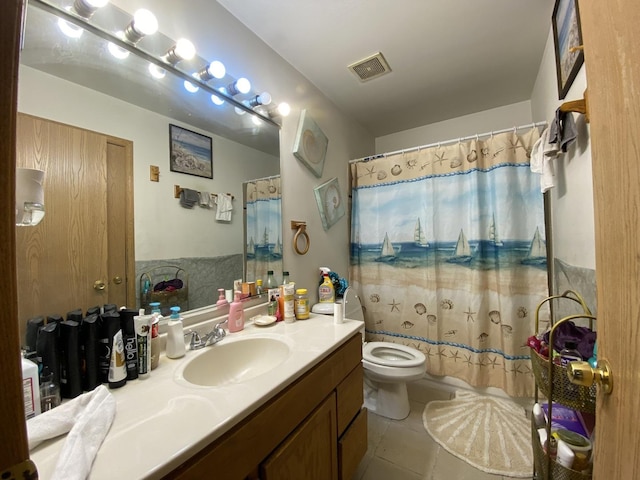 bathroom featuring toilet, tile patterned flooring, visible vents, and vanity
