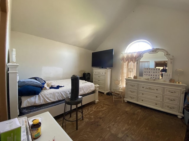 bedroom with dark wood-style flooring and lofted ceiling