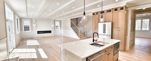 1911 S Prospect Ave, Park Ridge, IL 60068 - kitchen featuring high quality fridge, light wood-type flooring, a decorative wall, and a sink