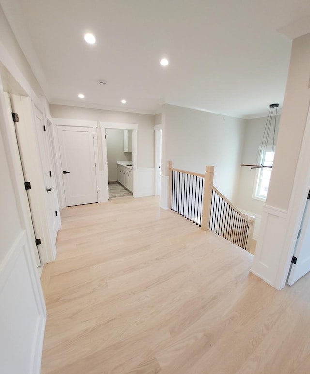 1911 S Prospect Ave, Park Ridge, IL 60068 - hallway featuring recessed lighting, an upstairs landing, light wood-type flooring, crown molding, and a wainscoted wall