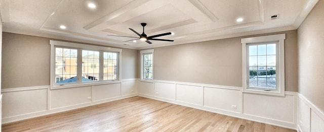 1911 S Prospect Ave, Park Ridge, IL 60068 - empty room with light wood-type flooring, a tray ceiling, and wainscoting