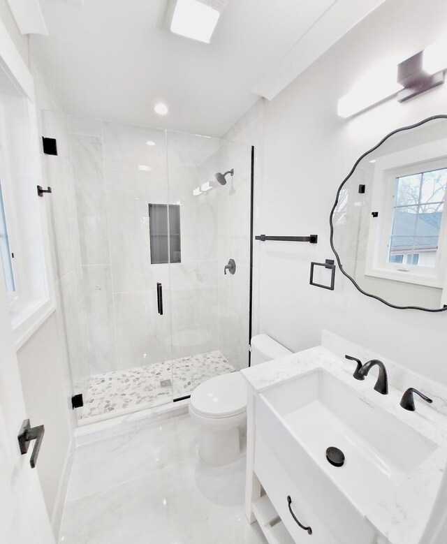 1911 S Prospect Ave, Park Ridge, IL 60068 - full bath with recessed lighting, marble finish floor, toilet, vanity, and a stall shower