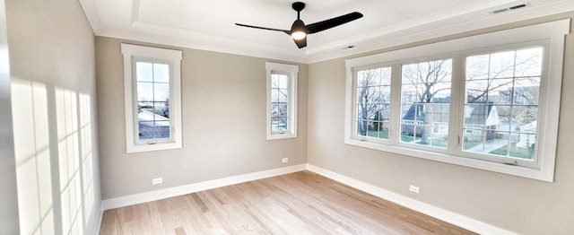 1911 S Prospect Ave, Park Ridge, IL 60068 - spare room featuring a tray ceiling, visible vents, baseboards, and a healthy amount of sunlight