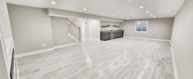 1911 S Prospect Ave, Park Ridge, IL 60068 - below grade area with recessed lighting, stairs, a sink, and light wood-style flooring