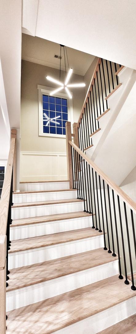 1911 S Prospect Ave, Park Ridge, IL 60068 - stairs featuring a chandelier and visible vents