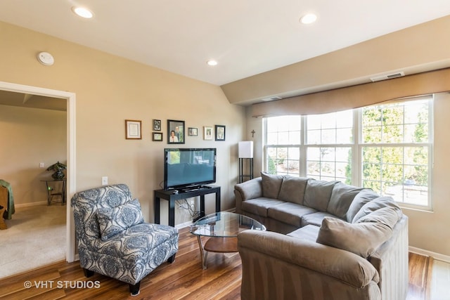 13474 Lehigh St, Huntley, IL 60142 - living area with baseboards, visible vents, wood finished floors, and a healthy amount of sunlight