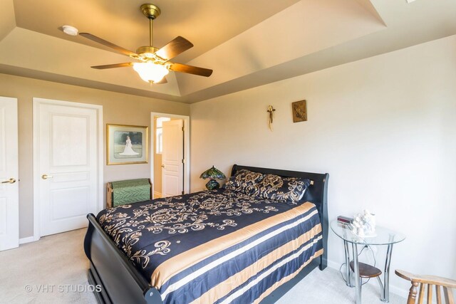 13474 Lehigh St, Huntley, IL 60142 - bedroom with baseboards, a ceiling fan, light colored carpet, and a tray ceiling