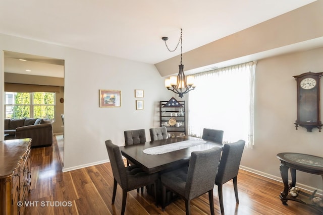 13474 Lehigh St, Huntley, IL 60142 - dining space featuring wood finished floors, a notable chandelier, and baseboards