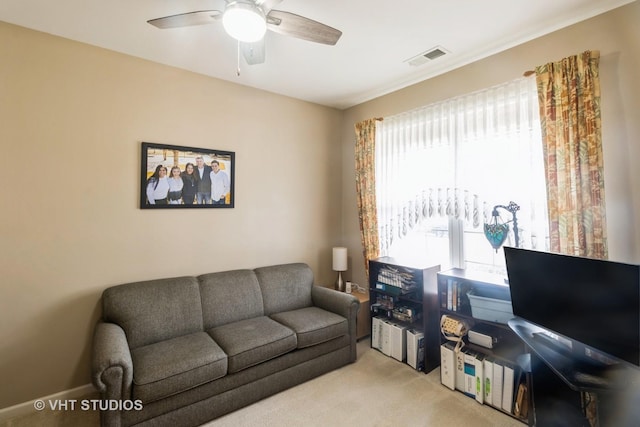 13474 Lehigh St, Huntley, IL 60142 - living room with visible vents, a ceiling fan, and light colored carpet