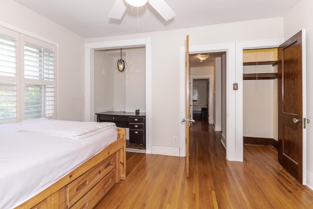bedroom with wood finished floors, baseboards, and ceiling fan
