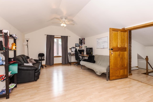 living area featuring light wood-type flooring, a ceiling fan, an office area, and lofted ceiling