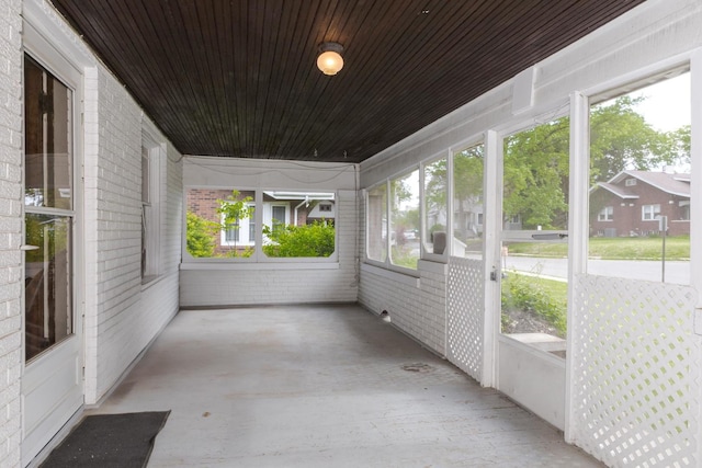 unfurnished sunroom with plenty of natural light