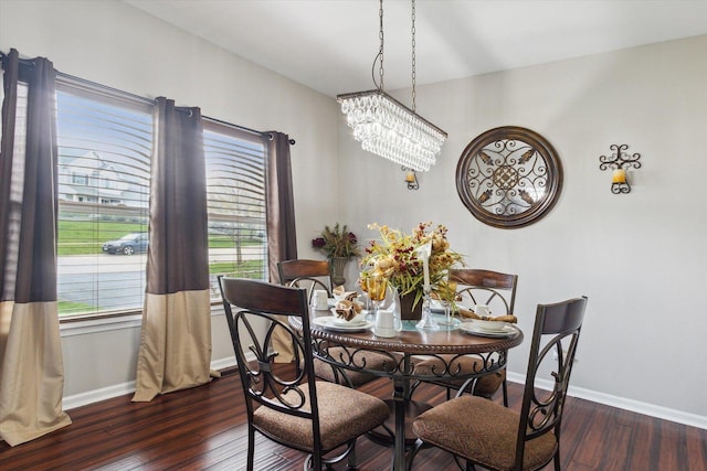 229 Stone Hollow Dr, Poplar Grove, IL 61065 - dining room with a notable chandelier, baseboards, and dark wood-style flooring