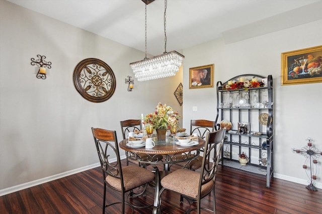 229 Stone Hollow Dr, Poplar Grove, IL 61065 - dining area with baseboards, wood finished floors, and an inviting chandelier