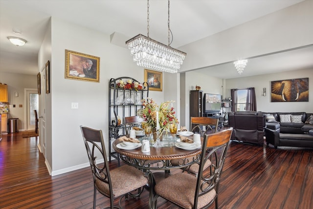 229 Stone Hollow Dr, Poplar Grove, IL 61065 - dining area with baseboards, dark wood-style floors, and a notable chandelier