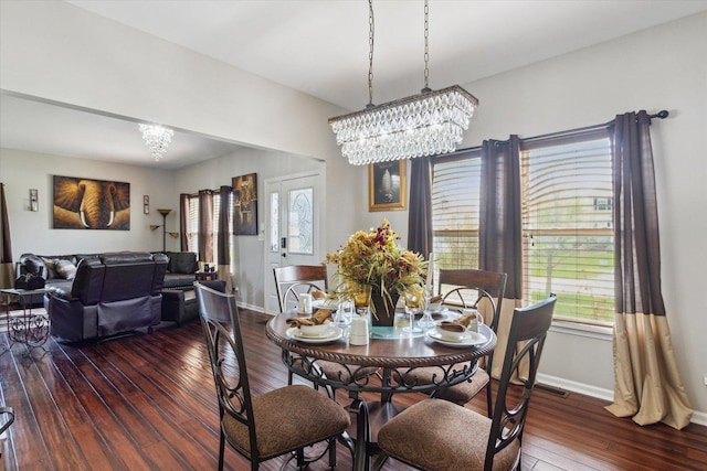 229 Stone Hollow Dr, Poplar Grove, IL 61065 - dining area with plenty of natural light, baseboards, a chandelier, and hardwood / wood-style floors