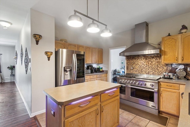 229 Stone Hollow Dr, Poplar Grove, IL 61065 - kitchen with a center island, decorative backsplash, pendant lighting, wall chimney exhaust hood, and appliances with stainless steel finishes