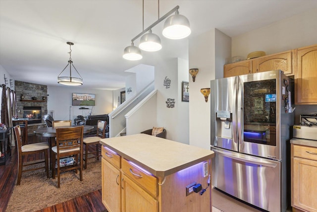 229 Stone Hollow Dr, Poplar Grove, IL 61065 - kitchen featuring hanging light fixtures, open floor plan, dark wood finished floors, stainless steel refrigerator with ice dispenser, and a kitchen island