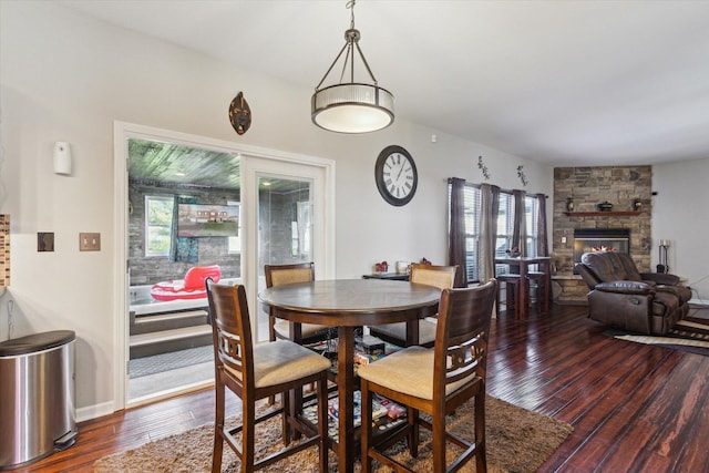229 Stone Hollow Dr, Poplar Grove, IL 61065 - dining room with a fireplace and wood finished floors