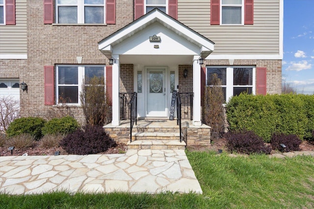 229 Stone Hollow Dr, Poplar Grove, IL 61065 - property entrance featuring brick siding