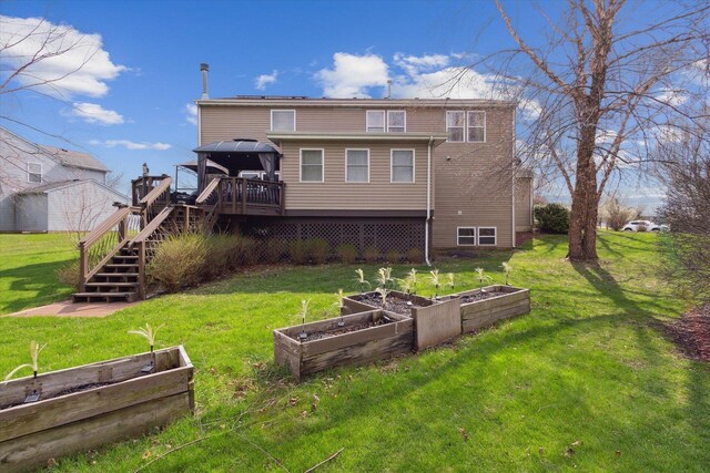229 Stone Hollow Dr, Poplar Grove, IL 61065 - rear view of property featuring a vegetable garden, stairs, a wooden deck, a lawn, and a gazebo