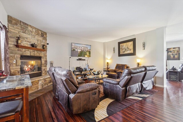 229 Stone Hollow Dr, Poplar Grove, IL 61065 - living area with a stone fireplace and dark wood-style floors