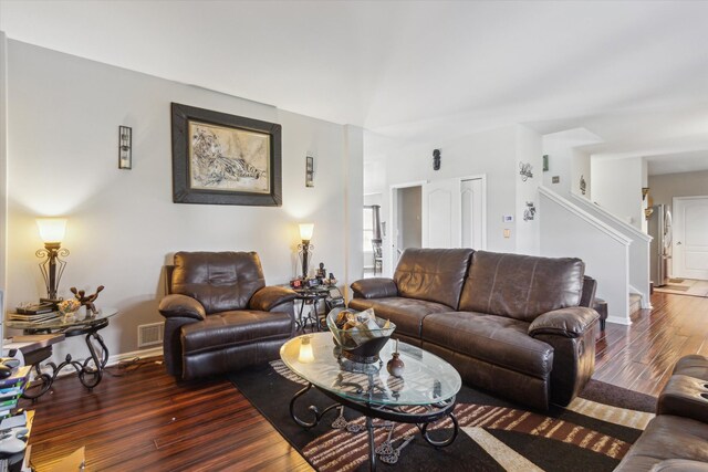 229 Stone Hollow Dr, Poplar Grove, IL 61065 - living room featuring visible vents, baseboards, wood finished floors, and stairs