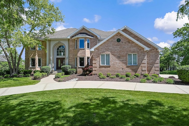 909 Prairie Ridge Ct, Burr Ridge, IL 60527 - view of front of home featuring a front lawn and brick siding