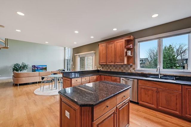 909 Prairie Ridge Ct, Burr Ridge, IL 60527 - kitchen with dishwasher, light wood-type flooring, a sink, brown cabinetry, and dark stone counters