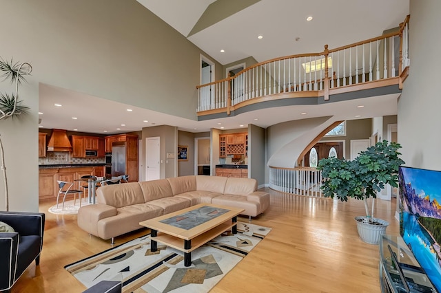 909 Prairie Ridge Ct, Burr Ridge, IL 60527 - living area with a towering ceiling, light wood-style flooring, and recessed lighting