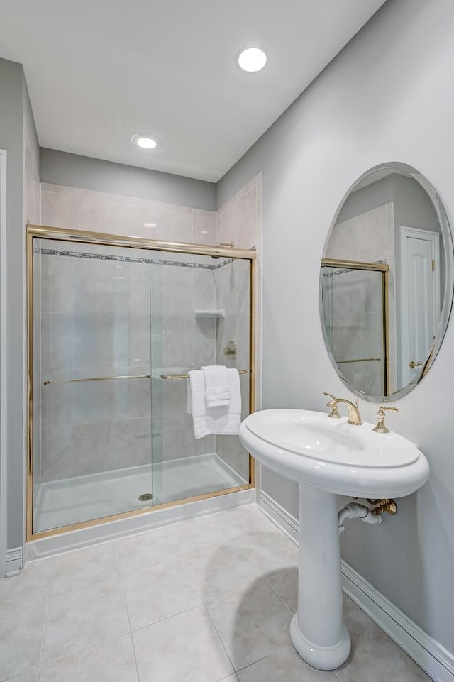 909 Prairie Ridge Ct, Burr Ridge, IL 60527 - bathroom with a stall shower, baseboards, tile patterned flooring, and recessed lighting