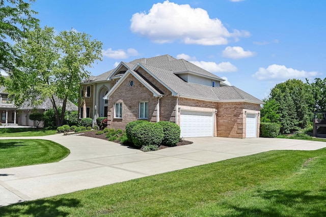 909 Prairie Ridge Ct, Burr Ridge, IL 60527 - view of front facade featuring a garage, a front yard, driveway, and brick siding